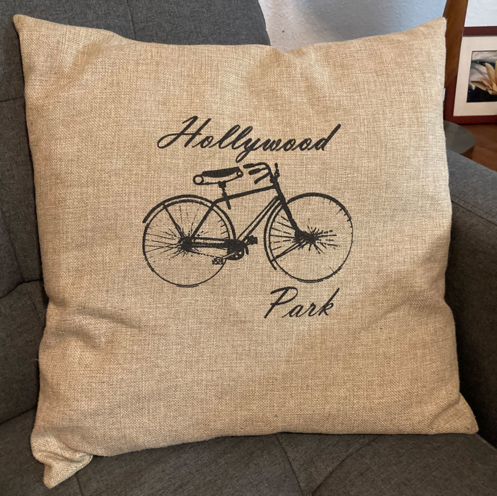pillow with hollywood park text and bicycle design